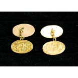 A 9ct gold pair of cufflinks, with engraved scrollwork decoration, 4.1g.