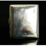 A silver cigarette case, with monogram engraved to the centre, gilt interior, 2.58toz.