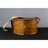 An antique fishing box, of demi-lune form, and shoulder strap, bearing brass clasp and initials to