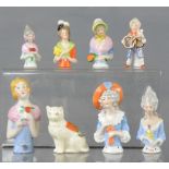 A group of ceramic doll tops, in the form of ladies, various size and style.