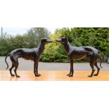 A pair of bronzed metal greyhounds.