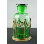 A French brass and green glass jar and cover.