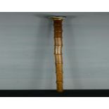 A bamboo walking cane with agate ball handle, and yellow metal collar, 92cm long.