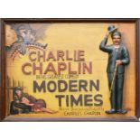 A wooden carved Charlie Chaplin 'Modern Times' advertising display sign.