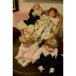 Four porcelain dolls.