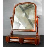 A mahogany toilet mirror, with two drawers.