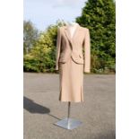 A Jaeger Wool & Camel hair two piece beige suit, size 10, with pleats to the skirt.