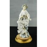 A Lladro figure, angel singing from the clouds, 28cm high.