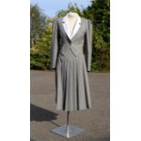 A Nipon Boutique made in the UK two piece suit with long skirt, grey, white collar, 100% Wool,