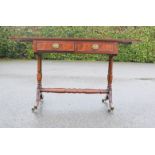 A mahogany sofa table, with drop leaves, two drawers and green leather oval insert.