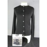 A Mary Quant of London black cardigan, together with a pair of vintage Mary Quant tights in the