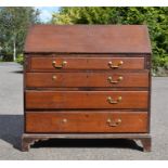 A Georgian bureau, the fall front enclosing a fitted interior, above four long graduated drawers.