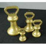 Four brass weights.