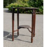 An Edwardian mahogany oval occasional table, with mid shelf.