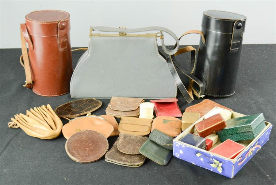 A group of leather purses, coin pouches, lens cases and jewellery boxes.