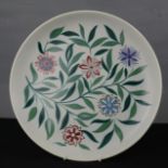 A Poole plate, floral pattern.