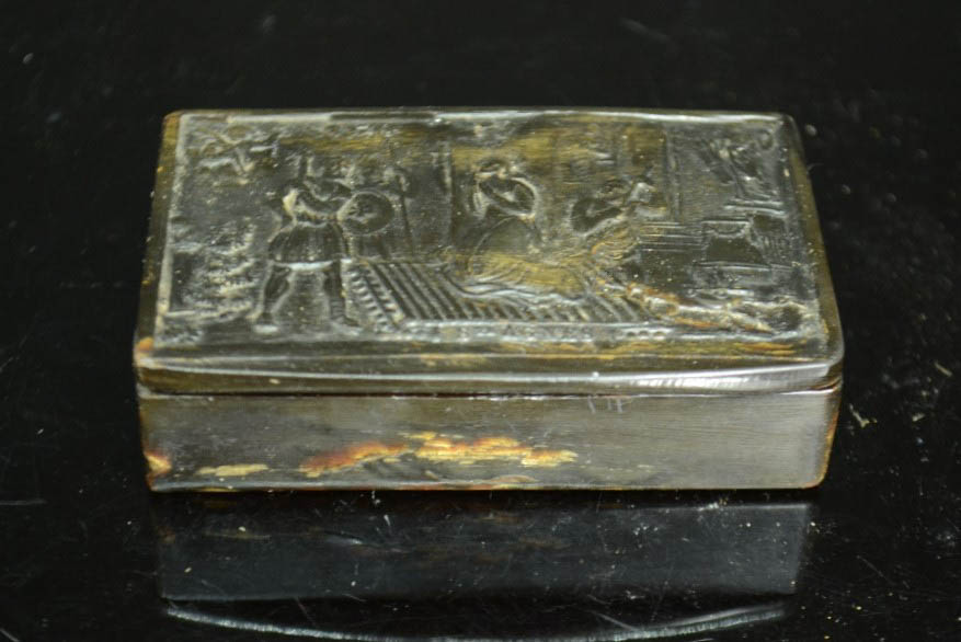 An 18th century horn box depicting St Agnes, 78 by 49mm.