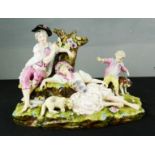 A Meissen porcelain figure group; children with lamb and a dog, blue crossed sword mark underside.