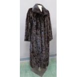 A mink ladies coat, calf length, with swing back, satin lined, size 38.