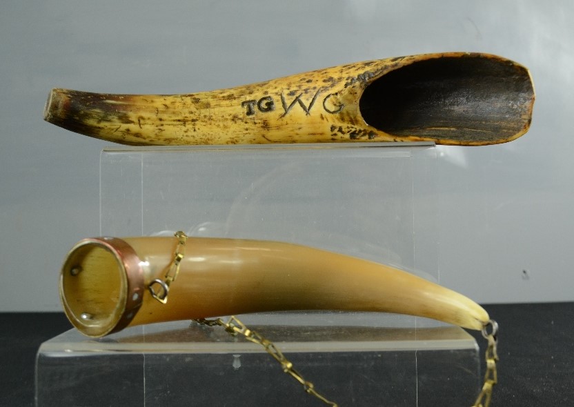 An early drenching horn, initialled TG, WC, together with a horn flask.