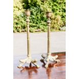 A pair of French 19th century brass candlesticks, with reeded columns, and paw form feet, 30cm high.