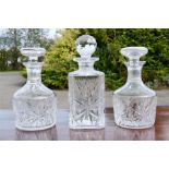 Three cut glass decanters, of various form.