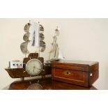 An Art Deco clock in the form of a ship by Metamec of Derham together with a mahogany inlaid writing