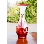 A Bohemian red glass vase, of baluster form, etched with decoration, 28cm high.