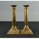 A pair of 19th century gun metal candlesticks.