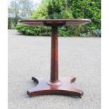 A 19th century mahogany occasional table, the column form base raised on a quatreform base.