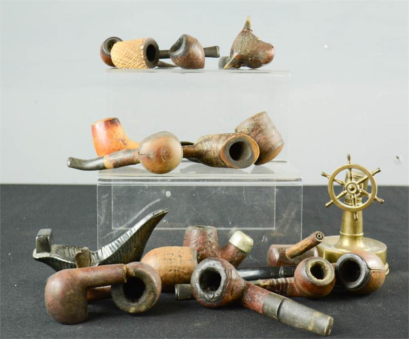 A group of various pipes, one in the form of a bulls head.