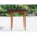 A 19th century mahogany Pembroke table, with two drop leaves, square tapered legs.