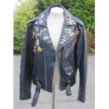 A gents leather biker jacket by B&S size 40, with motorbike related badges with a hand painted