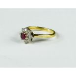 An 18ct gold, diamond and ruby flowerhead ring, 3.2g.