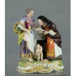 A Dresden porcelain figure group; Fortune Teller, circa 1800, 20cm high.