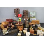 A group of collectables and boxes, including a New Zealand carved face mask.