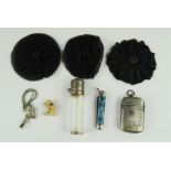 A vesta case, a silver top perfume bottle, three mourning brooches etc.