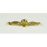 A Victorian yellow metal diamond brooch; the central roundel flanked by diamond studded shoulders,