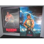 Two cinema posters; First Blood 1983; Rambo First Blood Part II 1985.