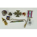 A group of badges and brooches, including a silver ARP badge, a BGS badge, British Legion pin etc.