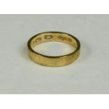 A Welsh gold wedding band hallmarked 375, size X/Y, 5.8g.