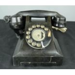 A bakelite black phone.