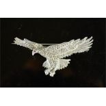 A silver and marcasite brooch in the form of an eagle.