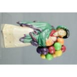 A Royal Doulton balloon seller.