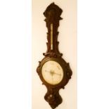 A Victorian carved oak barometer, by Leigton of Birmingham, 110cm high.