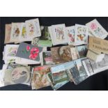 A group of early 20th century postcards, some coloured, including Snapshot Albums, and a group of