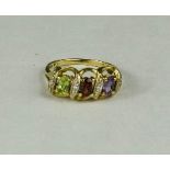 A 9ct gold and peridot, amethyst and garnet ring, size P, 2.7g.