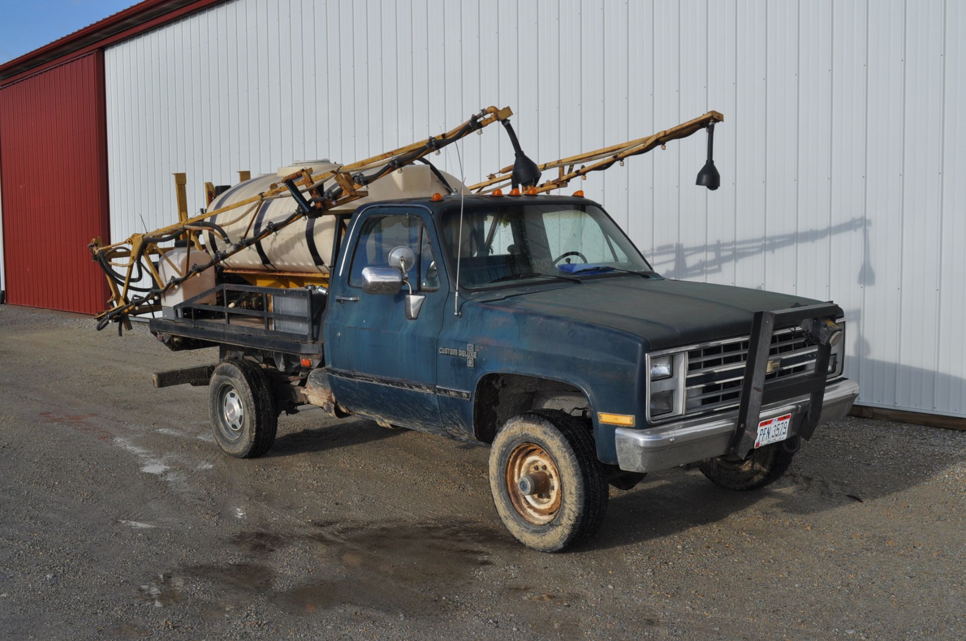 1985 1 ton Chevy pickup truck, flatbed with 400 gal skid sprayer, 40' booms, elec over hyd, 350