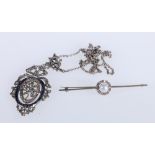 Unhallmarked bar brooch set with central faux pearl encircled by a ring of small diamonds, 6cm,