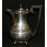 Silver hot water jug with gadrooned edge, banded body raised on ball supports, Chester,